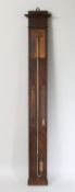 A 19TH CENTURY FRENCH MAHOGANY BAROMETER with three glass tubes, labelled Moreau. 42ins high.