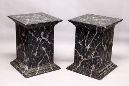 A LARGE PAIR OF PAINTED FAUX MARBLE PEDESTALS. 2ft 5ins high x 1ft 9ins square.