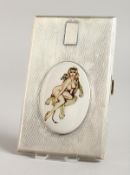 A GEORGE VI ENGINE TURNED SILVER CIGARETTE CASE, the top with an enamel of a nude in a chair with