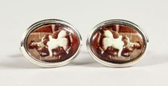 A PAIR OF SILVER AND ENAMEL EROTIC CUFFLINKS.