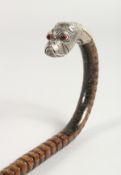 A CANE WALKING STICK with silver BULLDOG HANDLE with glass eyes. 36
