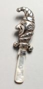 A SILVER AND MOTHER-OF-PEARL PUNCH RATTLE.