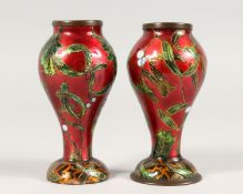 A SMALL PAIR OF 19TH CENTURY ENAMEL VASES. 4.5ins high.