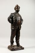 PAOLO TROUBETZKOY (1866-1938) RUSSIAN A CAST BRONZE OF A MAN STANDING HANDS ON HIPS, smoking a