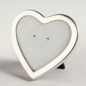 A TIFFANY SILVER HEART SHAPED PHOTOGRAPH FRAME. 2.5ins x 2.5ins.