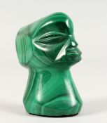 A CARVED MALACHITE TRIBAL HEAD. 2.5ins high.