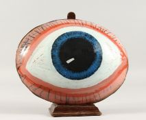 A LARGE GLASS EYE. 10ins x 8ins.