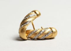 A MATCHING PAIR OF 18CT YELLOW GOLD AND DIAMOND SET HOOP EARRINGS. Diamonds: 0.8cts. Gold: 5.5gms.