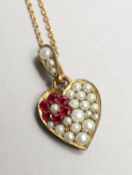 A GOOD PEARL SET PENDANT AND CHAIN.