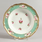 AN EARLY 19TH CENTURY DERBY SOUP PLATE painted with five roses around a central rose, under a raised