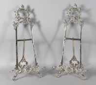 A GOOD LARGE PAIR OF SILVERED EASELS. 20ins high.
