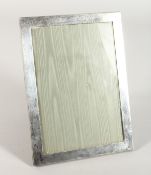 A PLAIN UPRIGHT PHOTOGRAPH FRAME. 9.5ins x 6.5ins.
