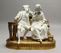 A SUPERB SEVRES WHITE BISQUE PORCELAIN AND ORMOLU GROUP, two figures sitting on an ormolu bench,