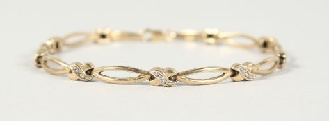A 9CT GOLD AND DIAMOND BRACELET. 6.9gms.