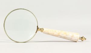 A MAGNIFYING GLASS with mother-of-pearl handle.
