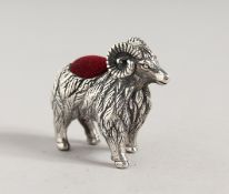 A SILVER RAM PIN CUSHION.