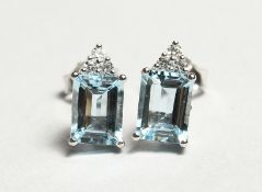 A PAIR OF 18CT WHITE GOLD, AQUAMARINE AND DIAMOND EARRINGS. Aquamarine: 2.75cts. Diamonds: 0.15cts.