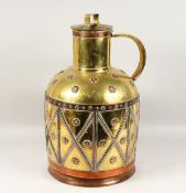 A LARGE BRASS WATER JUG. 23ins high.
