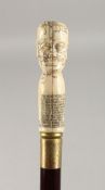 A CARVED BONE HANDLED WALKING CANE, PHRENOLOGY HEAD. 36ins long.
