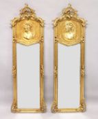 A LONG PAIR OF GILT UPRIGHT MIRRORS. 5ft 9ins high x 1ft 8ins wide.