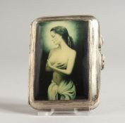 A GEORGE V ENGINE TURNED CIGARETTE CASE, the top with an enamel of a three-quarter length nude.