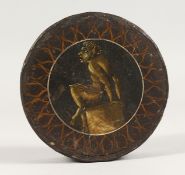 A 18TH CENTURY PAPIER MACHE CIRCULAR BOX, the lid painted with a satyr. 4ins diameter.