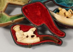 A SMALL CARVED HORSE MEERSCHAUM PIPE in a leather case, a spare case and another (AF) (3).