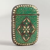 A BRASS AND ENAMEL VESTA.