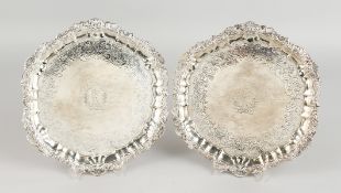 A GOOD PAIR OF GEORGE IV SILVER HEXAGONAL SHAPED SALVERS, 10ins diameter, with shaped and shell