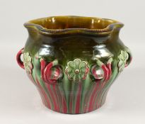A CHRISTOPHER DRESSER LINTHORPE POTTERY JARDINIERE, the sides with six moulded handles. 9ins high