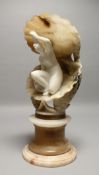 A VERY GOOD ALABASTER AND MARBLE GROUP, a nude inside a shell, on a pedestal base. 13ins high.