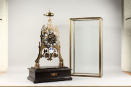 A CATHEDRAL FOUR DIAL BRASS SKELETON CLOCK, with enamel dials, striking on a single bell. 21ins