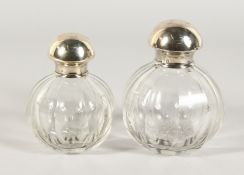 TWO SILVER TOP SCENT BOTTLES.