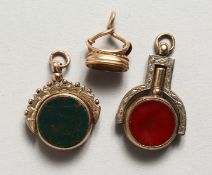 THREE GOLD FOBS.