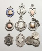 NINE SILVER FOBS.