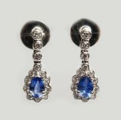 A SUPERB PAIR OF 18CT WHITE GOLD, PEAR SHAPED SAPPHIRE AND DIAMOND DROP EARRINGS. Sapphire: 0.68cts.