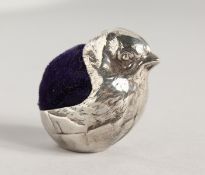 A SILVER CHICK PIN CUSHION.