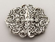 A PIERCED SILVER NURSES BUCKLE.