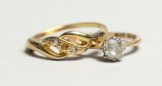 AN 18CT GOLD DIAMOND RING and A ROPE TWIST RING (2).