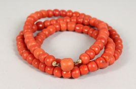 A SUPERB LARGE CORAL SINGLE STRAND NECKLACE with 18ct gold clasp. 30ins long. 100gms.