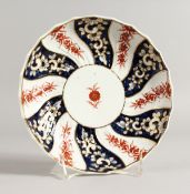 AN 18TH CENTURY CHELSEA DERBY SAUCER SHAPED DISH painted with a version of the Queen Charlotte