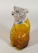A GOOD AMBER GLASS BEAR CLARET JUG with plate head and glass eyes. 7ins high.