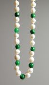 A 14K GOLD, JADE AND PEARL NECKLACE.