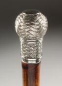 A WALKING CANE with ENTWINED SILVER HANDLE. 2ft 11ins long.