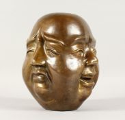 A LARGE CHINESE BRONZE FOUR FACED BUDDHA. 8ins high.