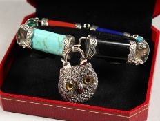 A SILVER SCOTTISH STONE TOGGLE BRACELET with owl padlock.
