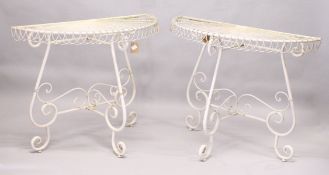 A GOOD PAIR OF WHITE PAINTED WIREWORK DEMILUNE TABLES. 2ft 10ins high x 3ft 5ins wide.