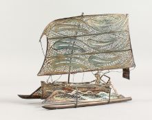 A CHINESE FILIGREE SILVER BOAT.