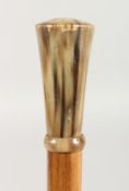 A WALKING CANE WITH HORN HANDLE. 2ft 11ins long.