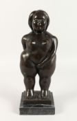 A BRONZE OF A FAT GIRL on a marble base. 13ins high.